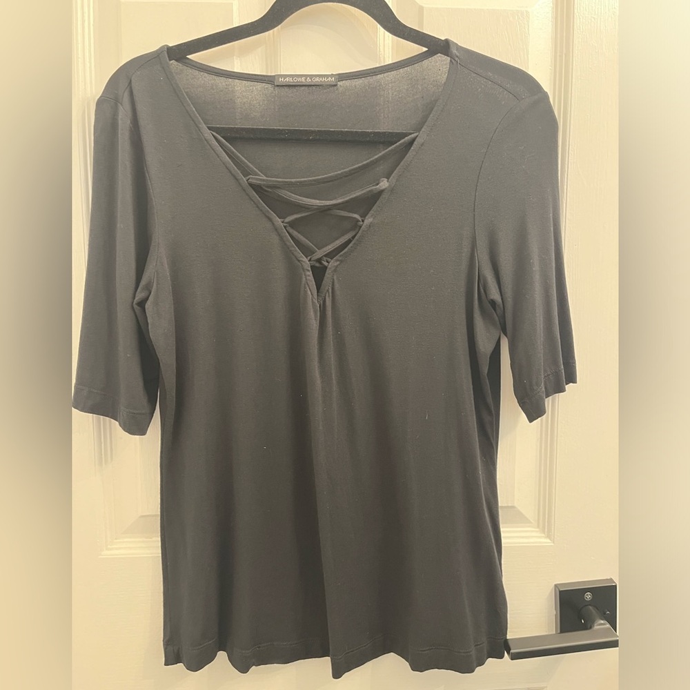 Black blouse, cute with crisscross in front, size small.